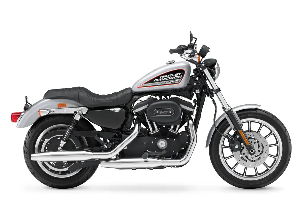 Right-side studio view of a 2013 Harley-Davidson 883 Roadster XL883R, international specification.