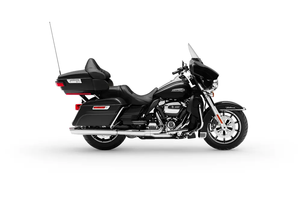 Right-side studio view of a black 2019 Harley-Davidson Electra Glide Ultra Classic with a Tour-Pak, fairing lowers and chrome exhaust.