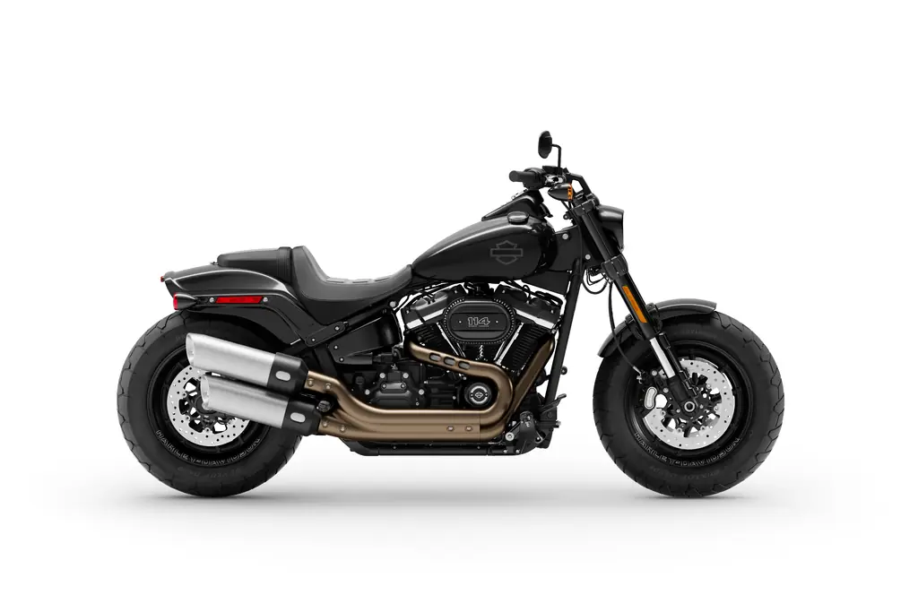 Side view of a black 2020 Harley-Davidson Fat Bob 114 with its twin stacked exhausts and fat front tyre