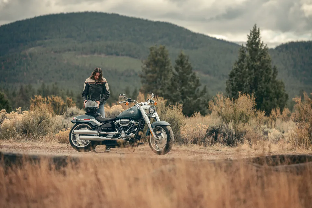 A Harley-Davidson Fat Boy 114 parked on a track in open country