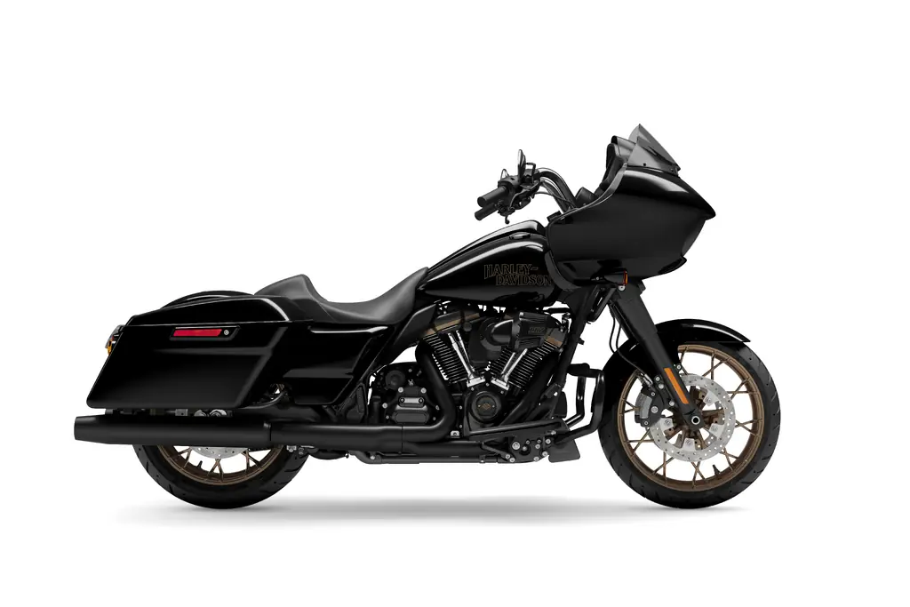 2023 Harley-Davidson Road Glide ST in Vivid Black, right side, studio shot, the pre-2024 sharknose fairing with low screen, bronze wheels and hard saddlebags