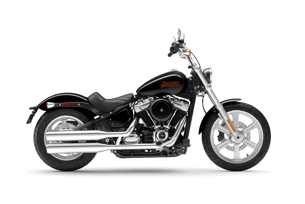 Right-side studio view of a black 2023 Harley-Davidson Softail Standard, with a solo seat, cast wheels and chrome exhaust.