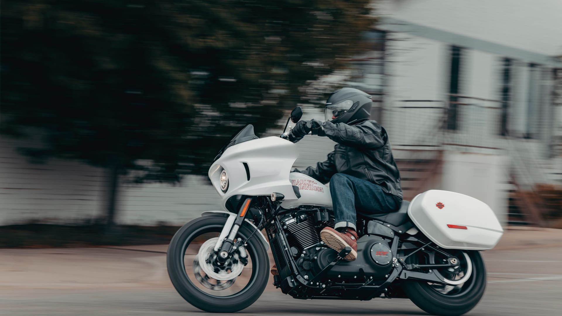 A rider on a Harley-Davidson on the road in the South West