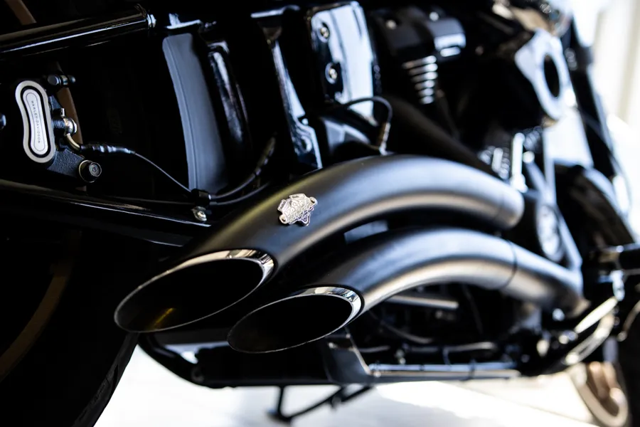 Vance & Hines exhaust system fitted to Harley-Davidson — workshop view